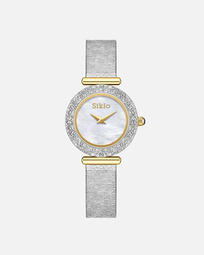 ساعة نسائية بتصميم مينا دائرية بتأثير مميز باللون الفضي الذهبي ميناء ابيض