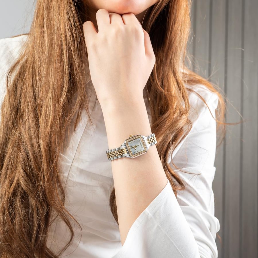 ساعة نسائية استيل واطار فصوص زركون باللون الذهبي والفضي ميناء ابيض