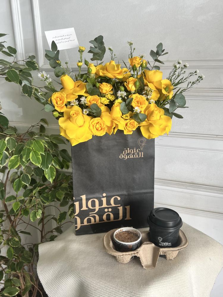 Coffee and sweets arranged on a bag with the coffee label