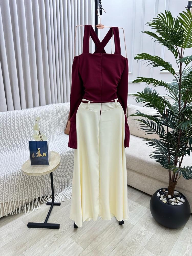 Maroon dress on beige with a tie at the waist decorated with raw pearls, from Joora store