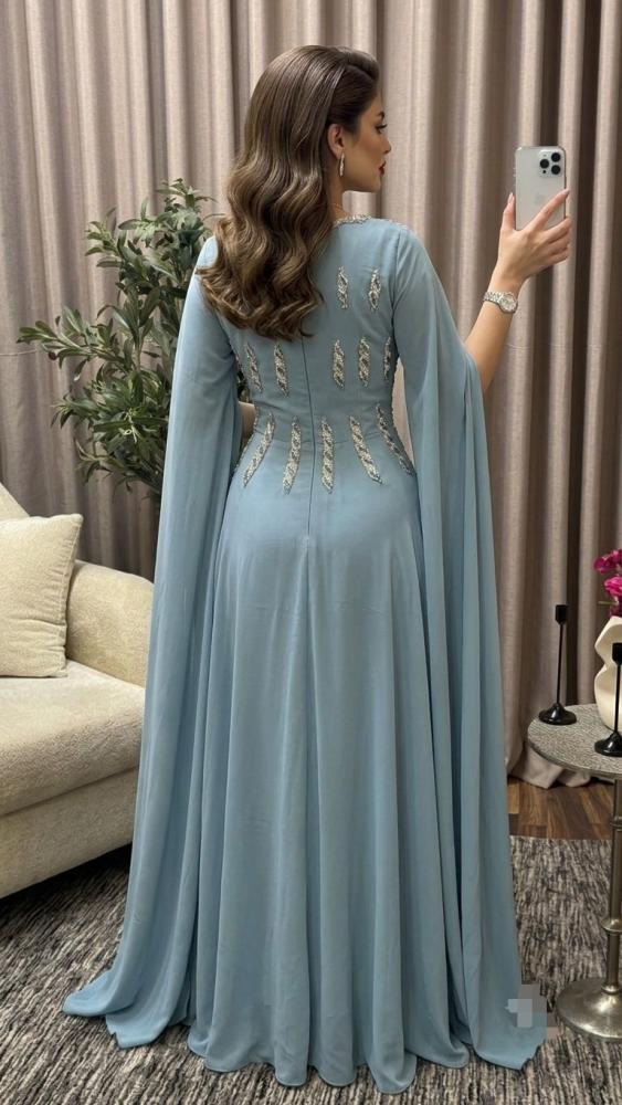 فستان سهره اللون سماوي مائل على رمادي شيفون جورجيت دبل كلوش و كلفه سهره    من متجر  جوهره LF