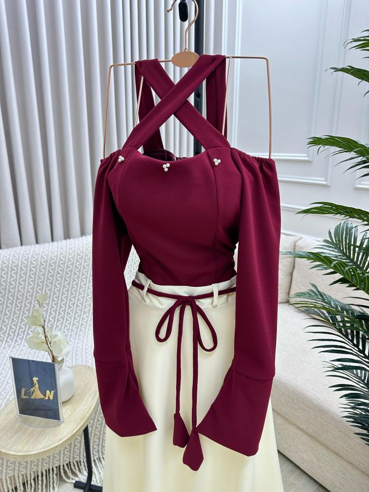 Maroon dress on beige with a tie at the waist decorated with raw pearls, from Joora store
