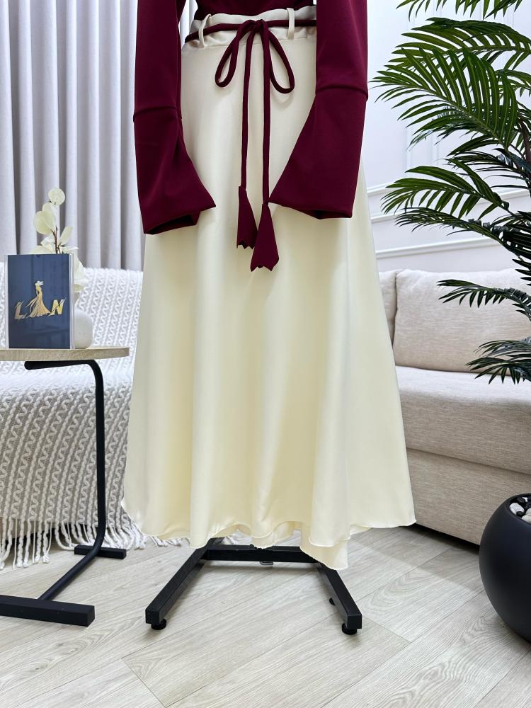 Maroon dress on beige with a tie at the waist decorated with raw pearls, from Joora store