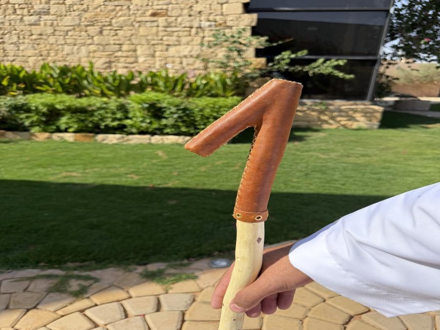 Natural wooden ladder stick covered with leather