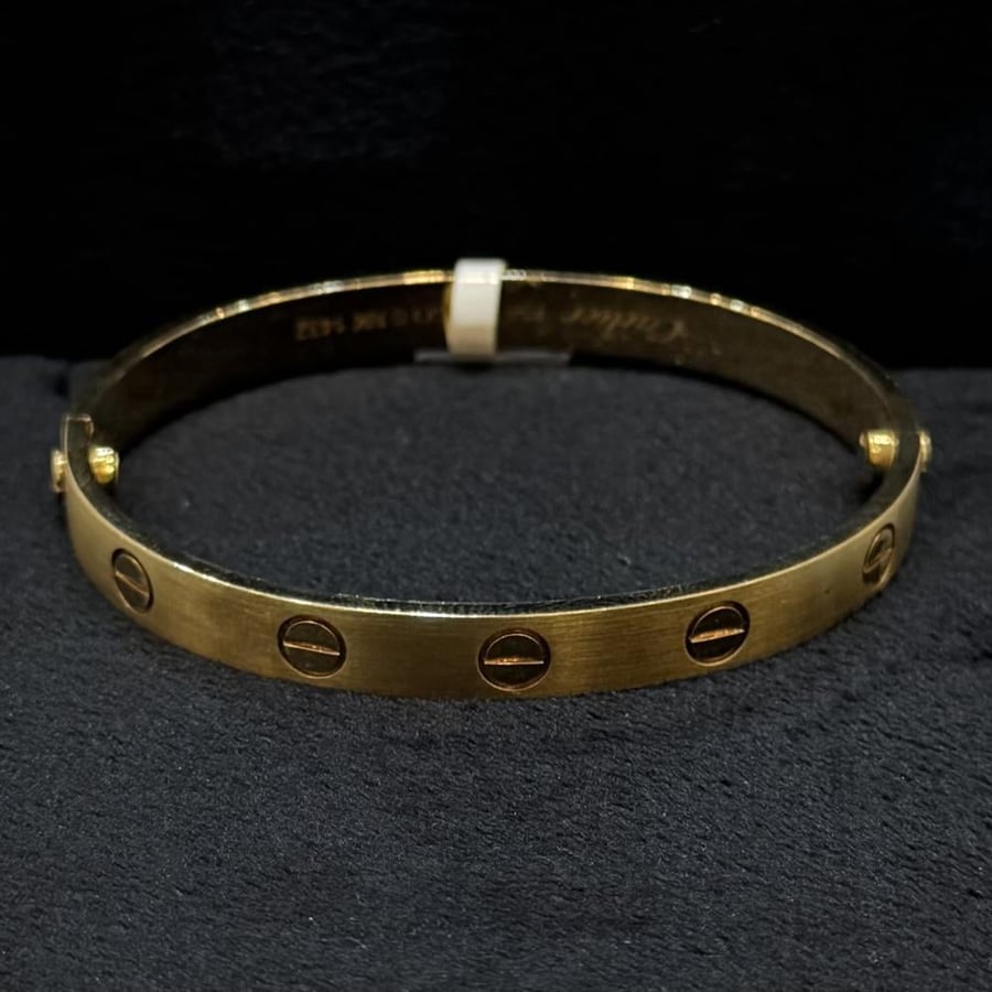 Gold bracelet, full casting, shiny, Carite design, two locks