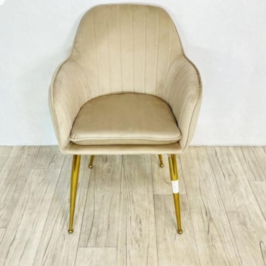 Velvet fabric chair in a bright color with metal legs