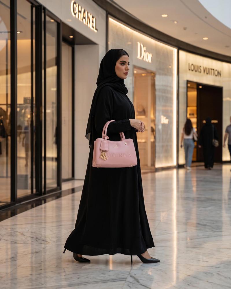 شنطة يد نسائية بتصميم أنيق من الجلد باللون الزهري
