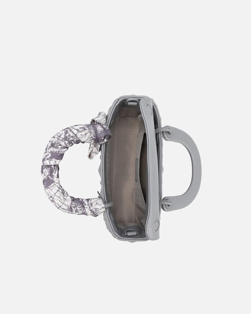Women's handbag with embossed gray leather