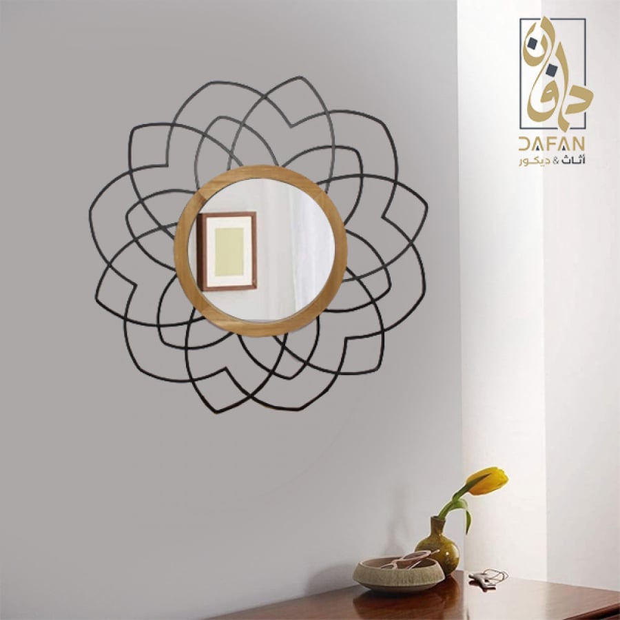 مرآة حائط مربعة سوداء تظهر حدة التصميم الهندسي وقوة الإطار المعدني