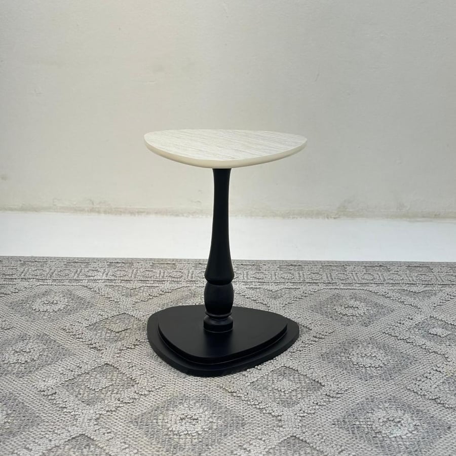 Triangular serving table, marble-like surface, wooden base, black color