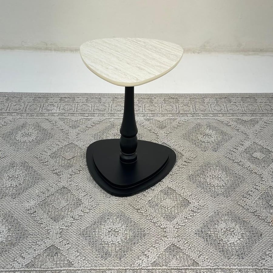 Triangular serving table, marble-like surface, wooden base, black color