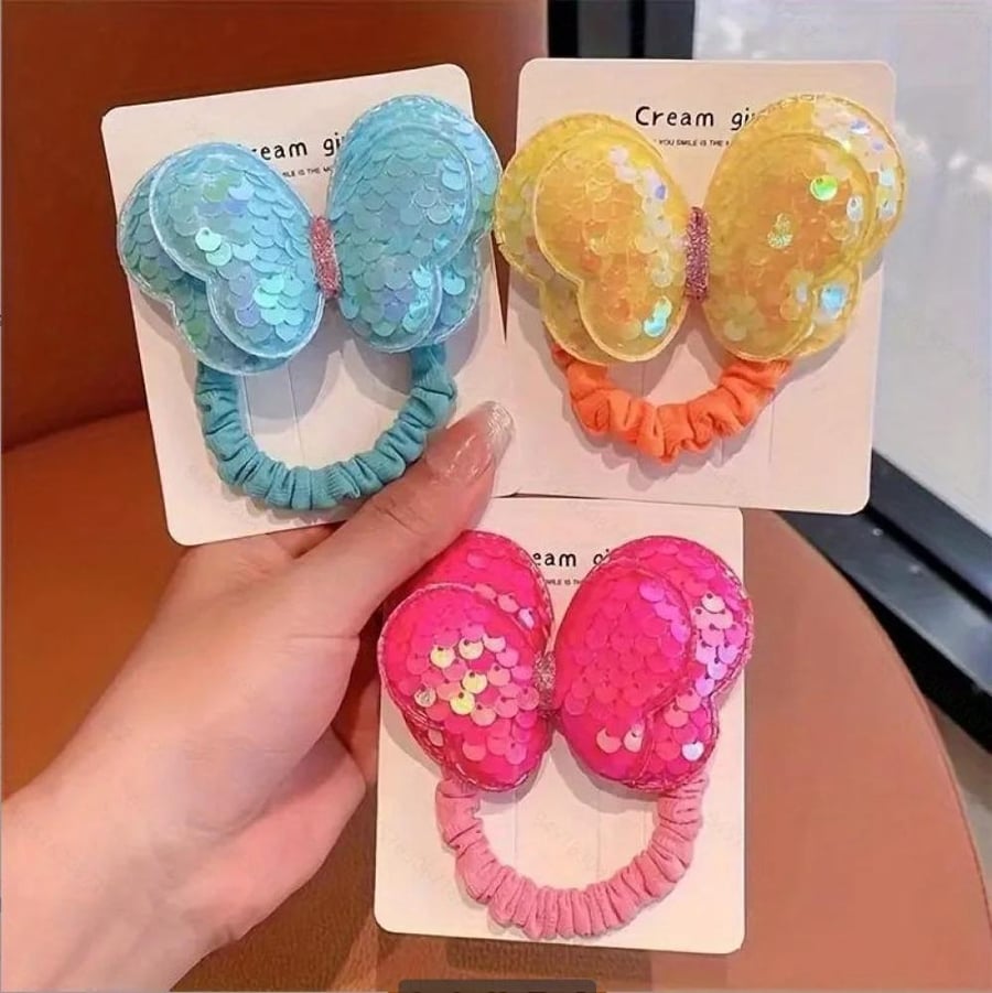A rubber hair band in the shape of a butterfly