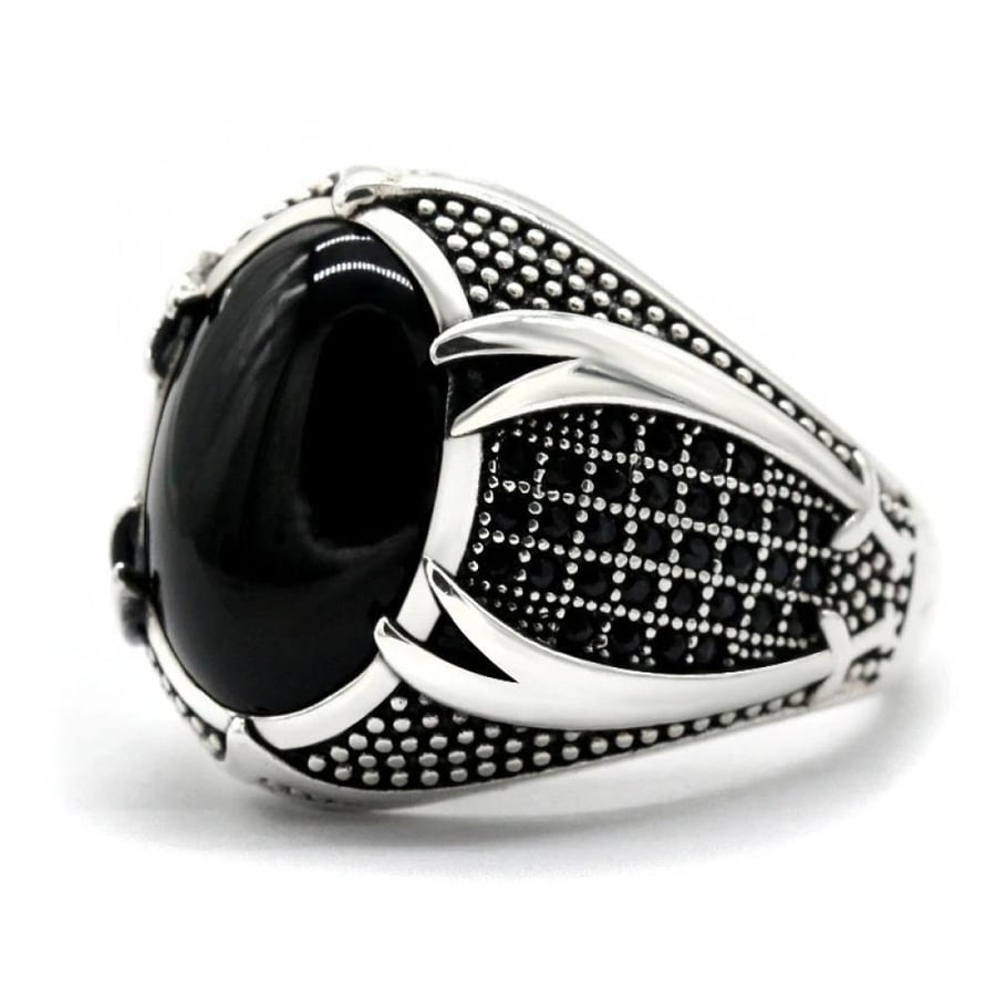 A vintage ring with a wicked style and a large stone