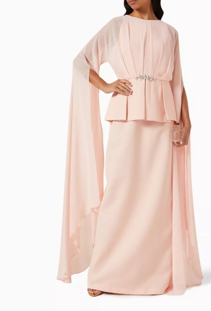 Evening dress with a feminine design, long cape, and a belt decorated with crystals