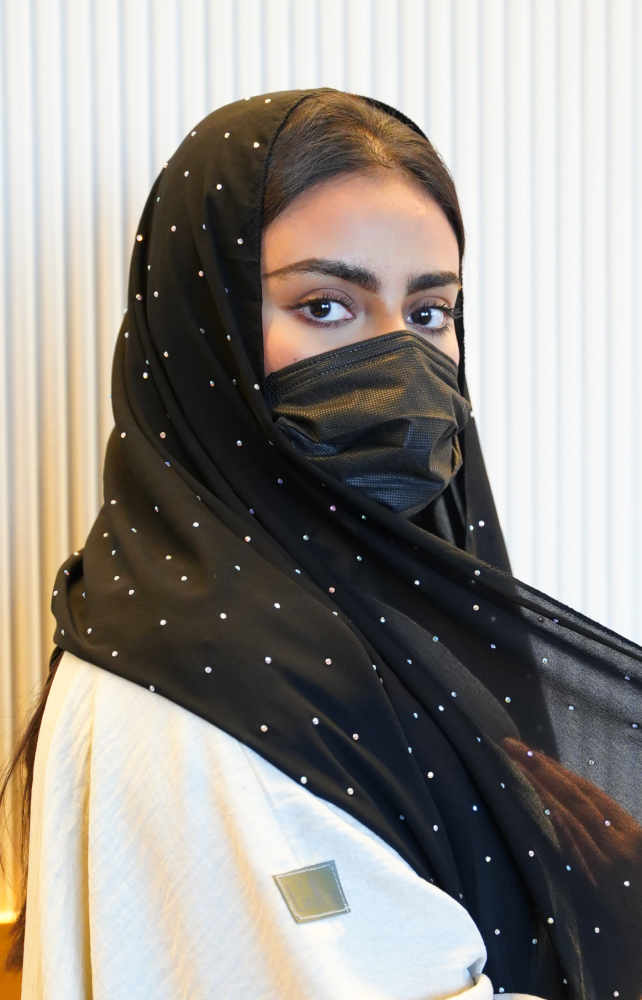 A headscarf with scattered stones