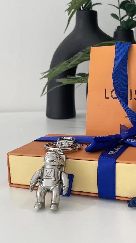 LV keychain medal in the shape of an astronaut, silver, with accessories