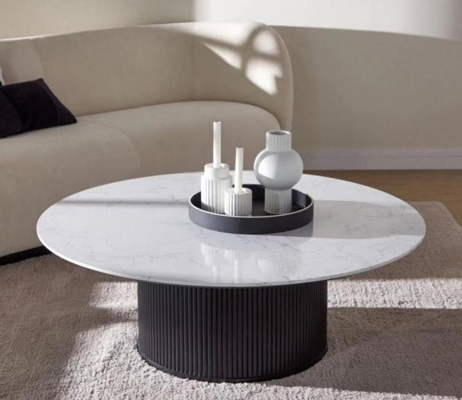Coffee table, high sofa, natural marble surface, underneath striped wood