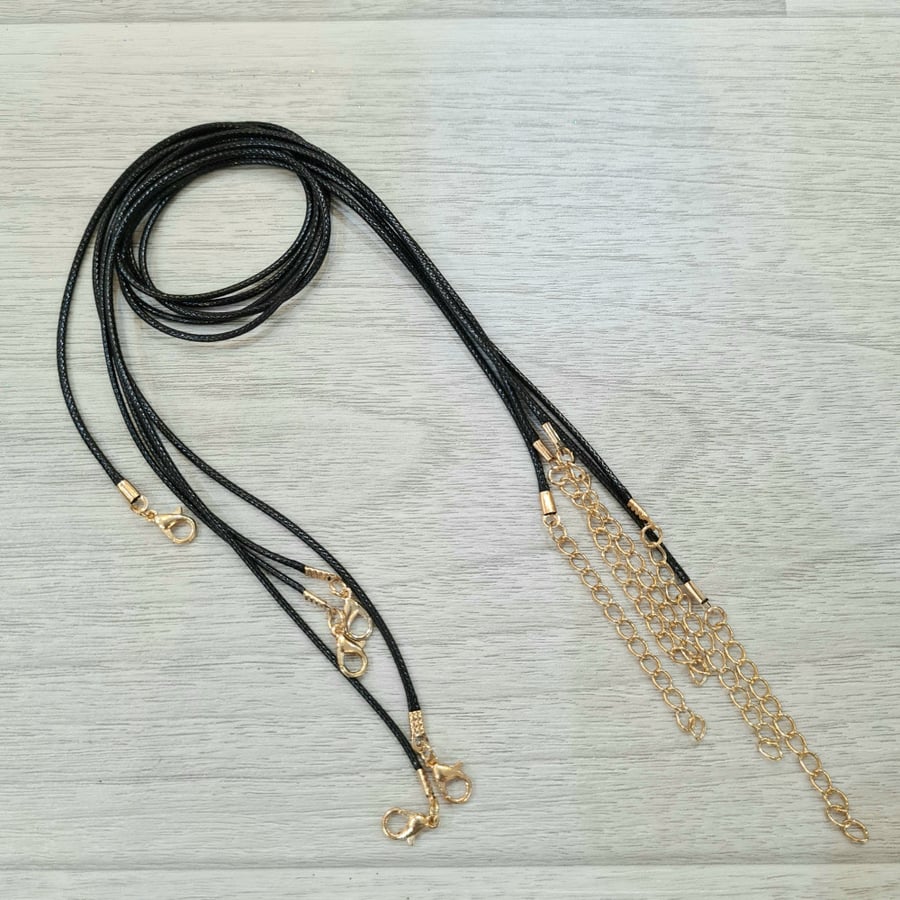 Black leather chains, silver and gold