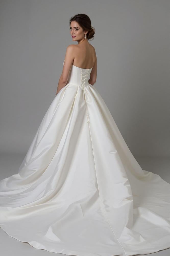 White royal wedding dress embroidered with luxurious details