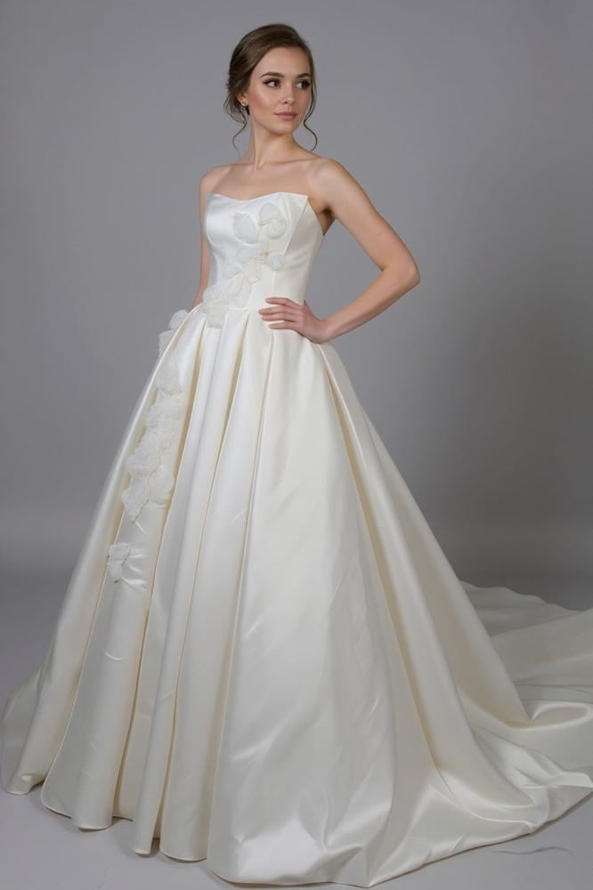 White royal wedding dress embroidered with luxurious details