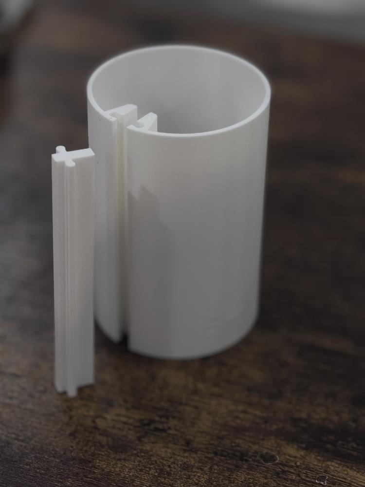 A tool or mold for manually shaping a cup (with slices)