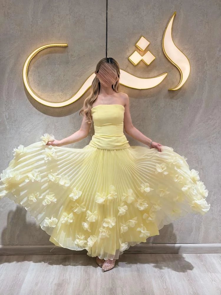فستان توغي / ورود من الليزر تنساب بين كسرات البليسيا