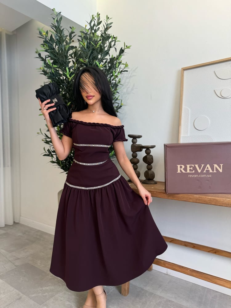 A midi Eid dress with delicate crystal details, exuding sophisticated feminine elegance from Rivan.