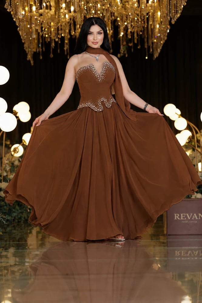 A crystal-embroidered evening dress, a sophisticated elegance from Rivan.