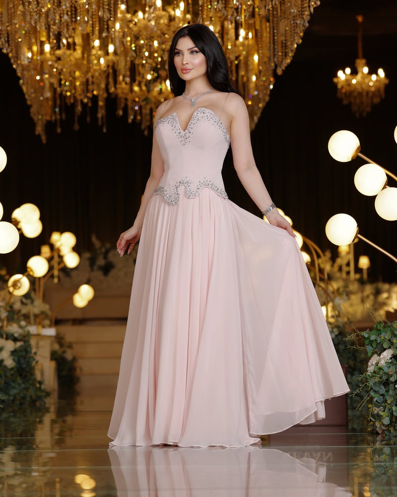 A crystal-embroidered evening dress, a sophisticated elegance from Rivan.