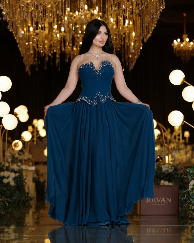 A crystal-embroidered evening dress, a sophisticated elegance from Rivan.