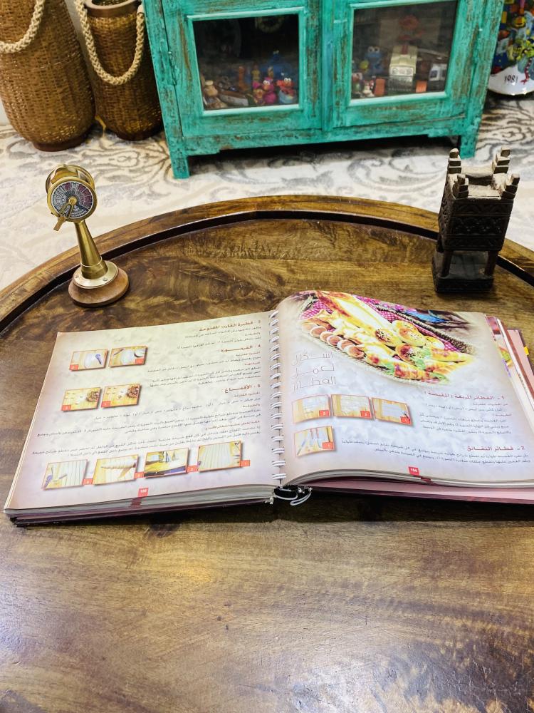 من البنود المميزة؛ كتاب نخبة الأطباق الشهير طبع عام ١٤٣٢هـ  ٢٠١١م
