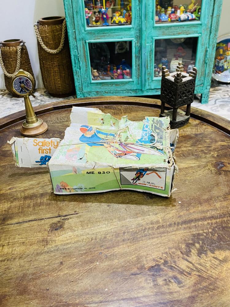 Among the rare items, children's toys; a stored bicycle toy, sealed cartons, stamped with white thread, not opened, for display only