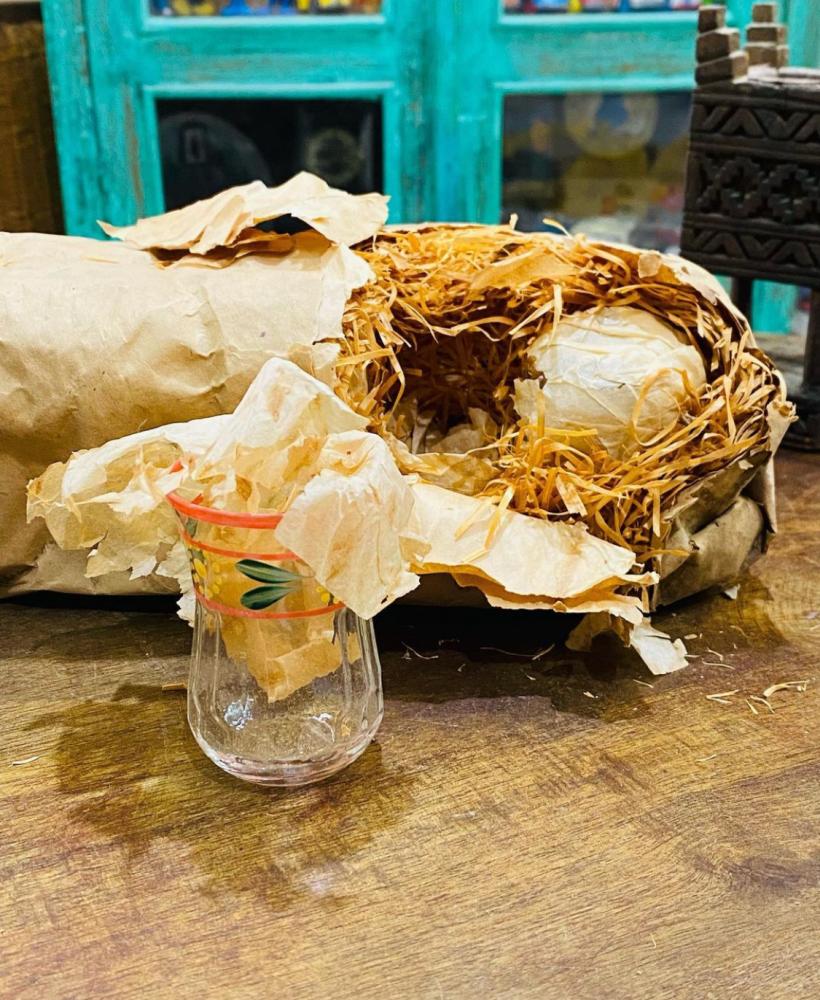 One of the very rare items; a wrapper containing handmade cups wrapped in straw; made especially for one of the palaces; about seventy years old; Czechslovakian craftsmanship; the price for the entire wrapper 12 cups