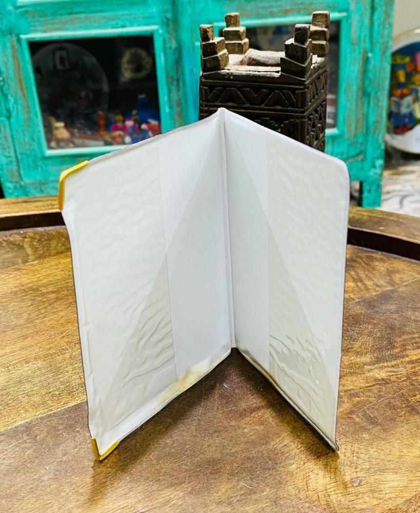 Among the distinguished items; a wallet or book to preserve (Hafezat Al-Noufous) with the state's emblem of two swords and a palm tree engraved on the cover of the book; as this Hafezat was issued by the Civil Status before the ID card; old, more than 45 