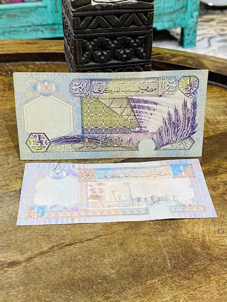 نصف وربع دينار ليبي الإصدار الخامس حالات جيدة جداً مع وجود قطع في فئة الربع موضح في الصور