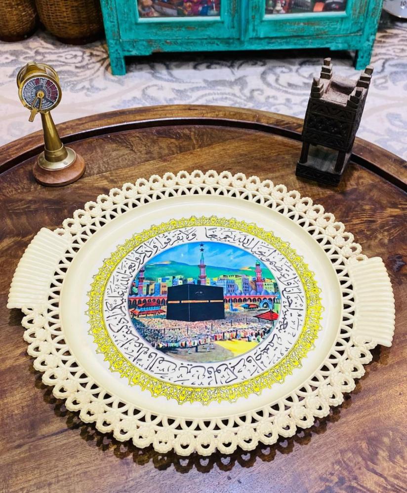 Among the rare items; a wall hanging or a tray made of sturdy plastic, equipped with an image of the Kaaba; an excellent storage container that has not been used.