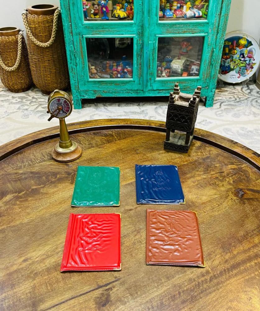 Among the distinguished items; a wallet or book to preserve (Hafezat Al-Noufous) with the state's emblem of two swords and a palm tree engraved on the cover of the book; as this Hafezat was issued by the Civil Status before the ID card; old, more than 45 