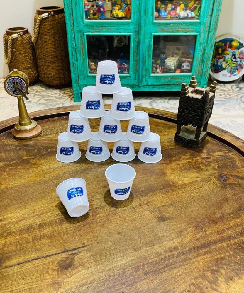 12 small plastic cups with Almarai company logo; price for everyone