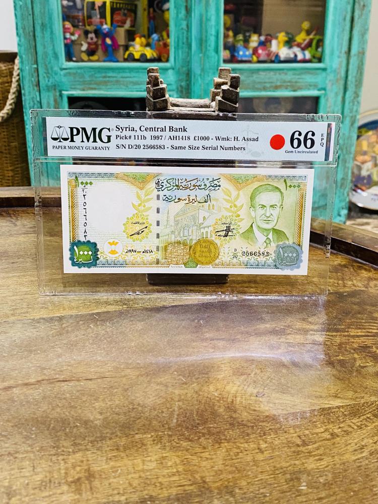 عملة سوريا فئة ١٠٠٠ ليرة عام ١٩٩٧م تقييم ٦٦ من شركة (PMG)