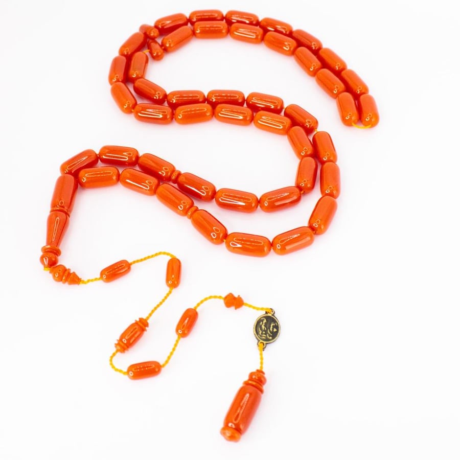 Orange-colored bowling rosary with a Tameeka