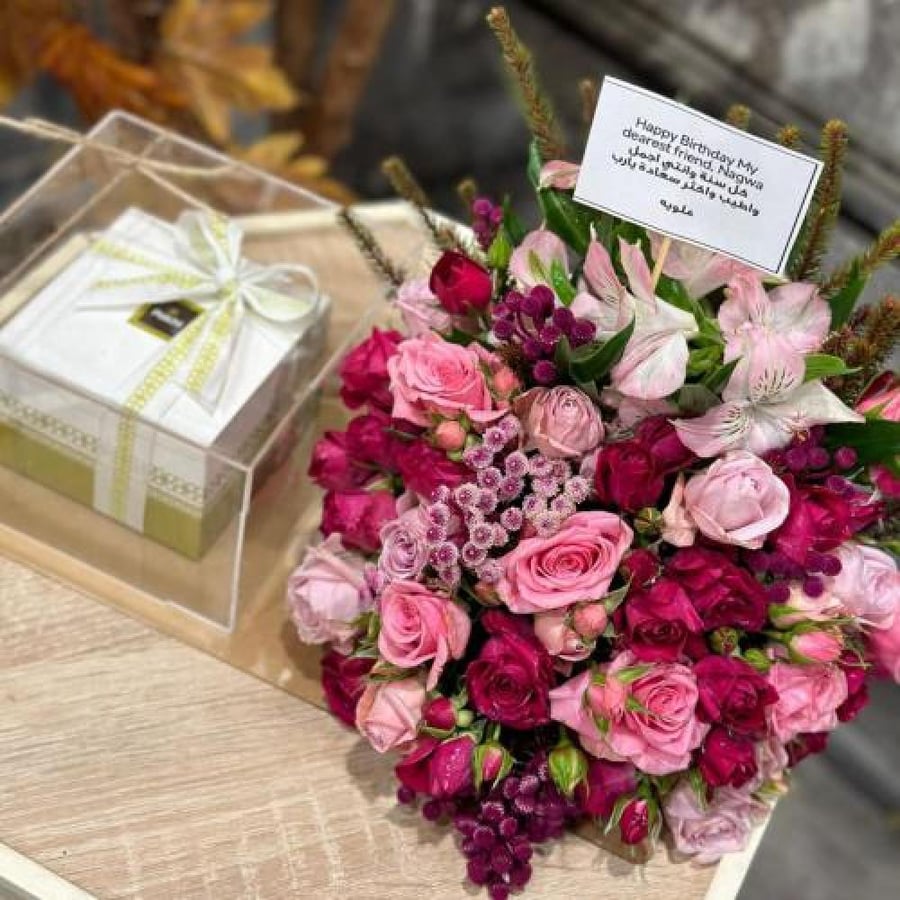 A bouquet of roses with Patchi chocolates, assorted roses