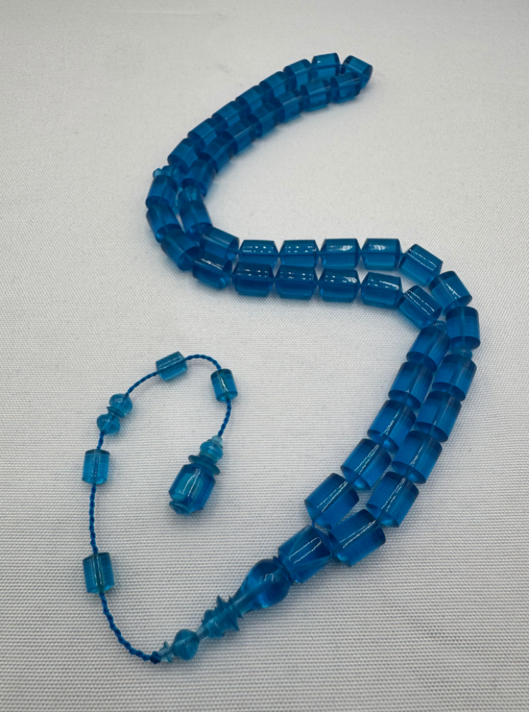 Blue transparent plastic prayer beads similar to cast