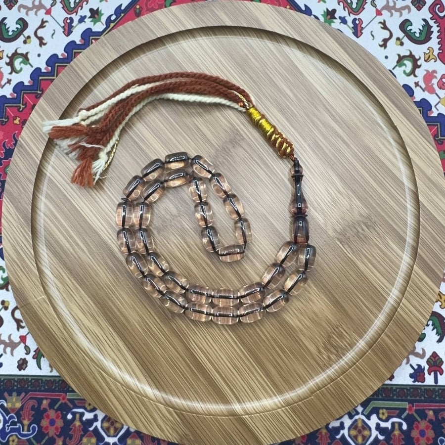 سبحة فاتوران شفاف – 33 خرزة – قصة بيضاوي – شاهد متناسق مع شرابة ثنائية اللون