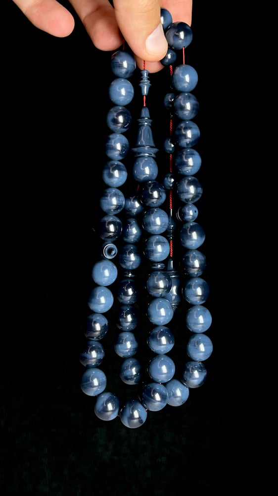 A tasbih with a beaded chain made of old sticks