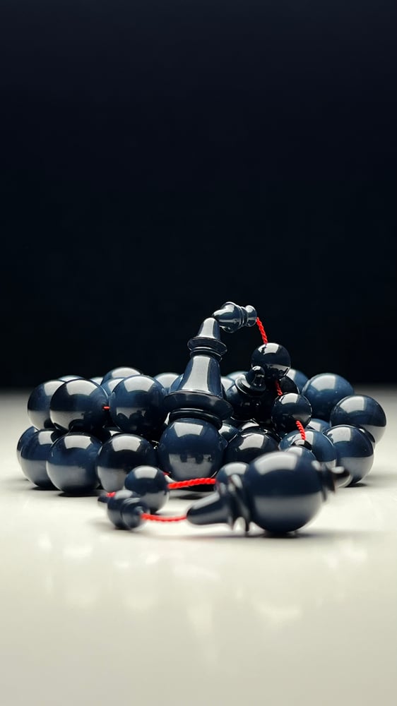 A tasbih with a beaded chain made of old sticks