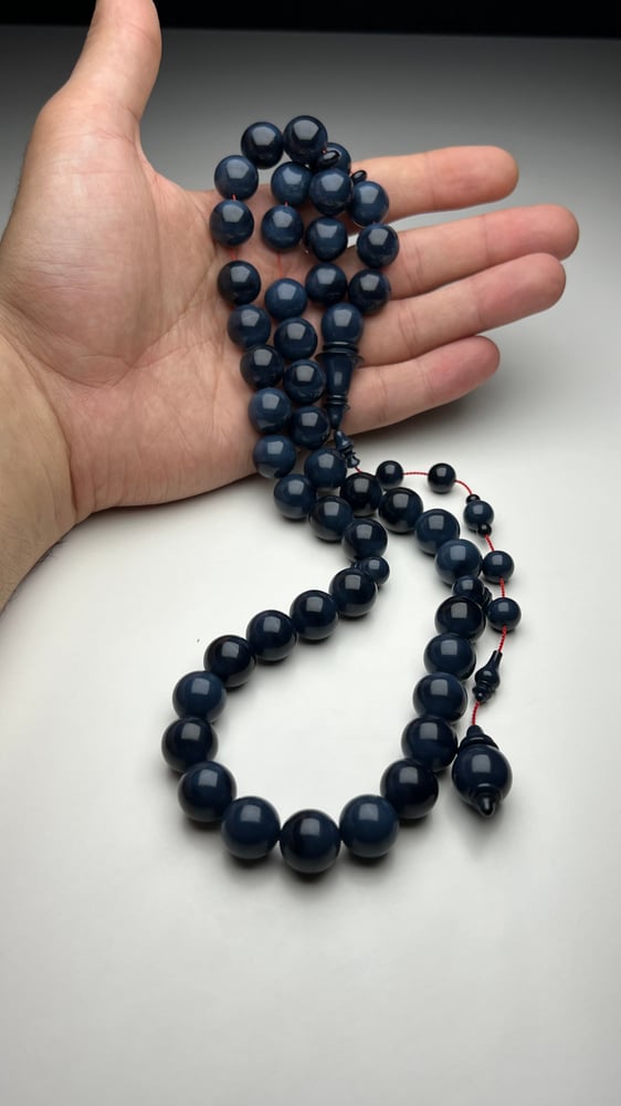 A tasbih with a beaded chain made of old sticks