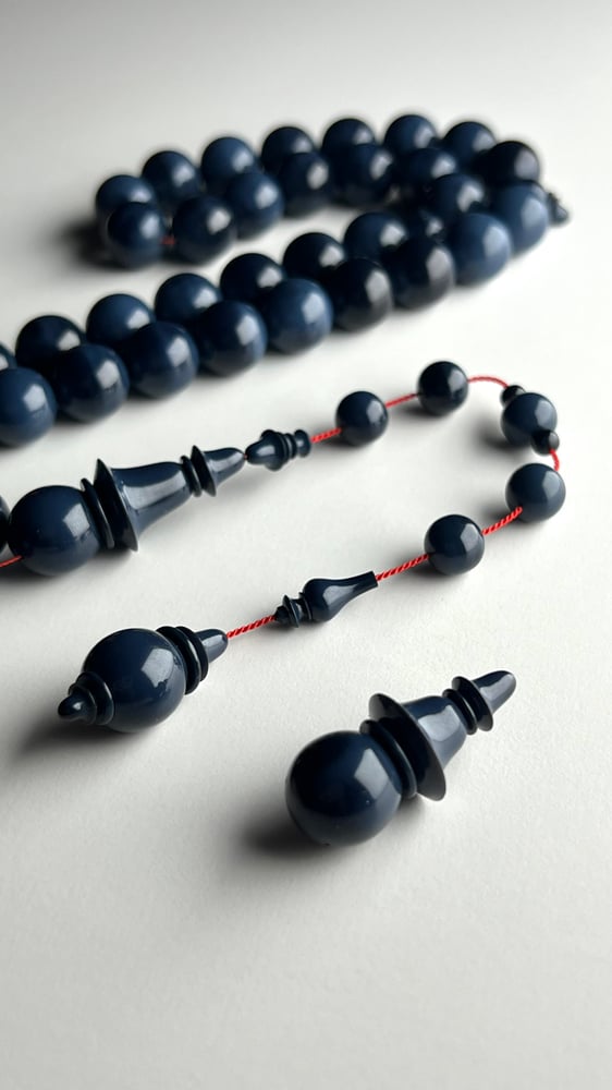 A tasbih with a beaded chain made of old sticks