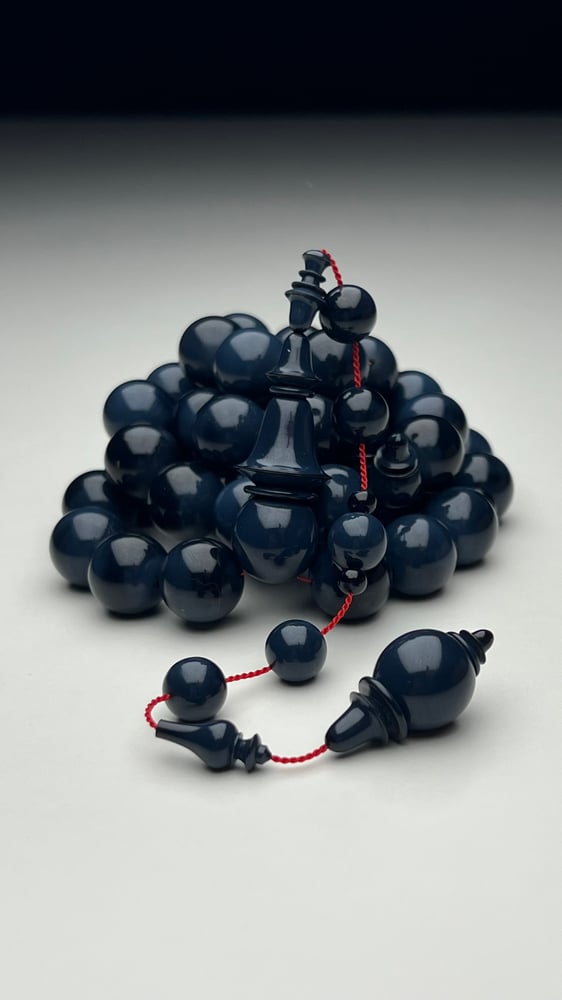A tasbih with a beaded chain made of old sticks