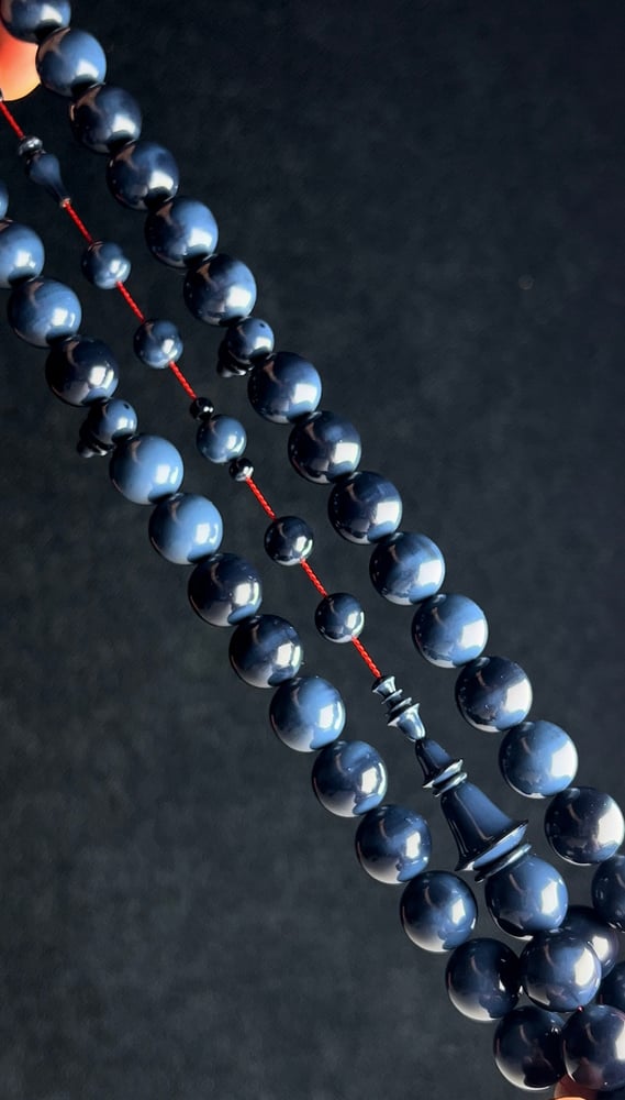 A tasbih with a beaded chain made of old sticks