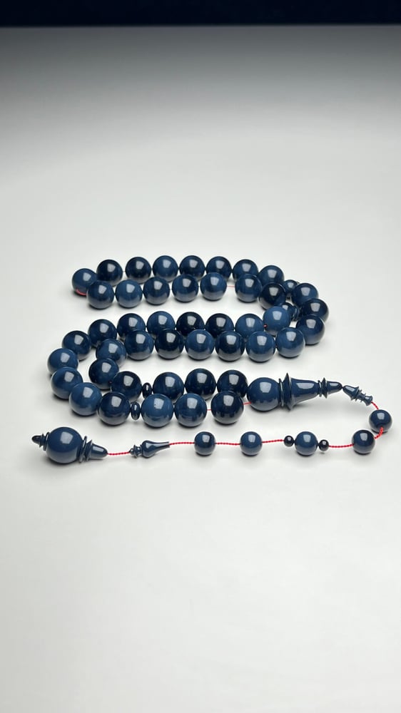 A tasbih with a beaded chain made of old sticks